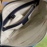 Side profile of signature refined women's handbag – women's everyday handbag