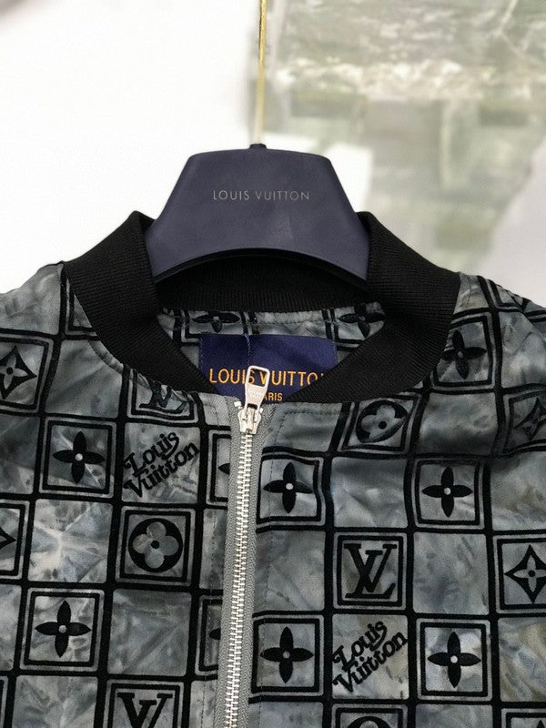 Flat lay presentation of Louis Vuitton luxury clothing with tailored silhouette