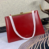 Front view of chic sleek women's handbag – women's luxury accessory