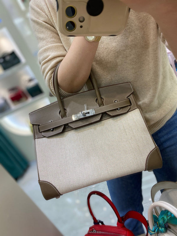 Side view of tailored structured handbag
