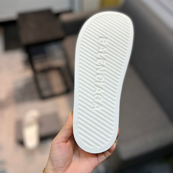 Balenciaga Black Flat Thong Sandals - Angled View