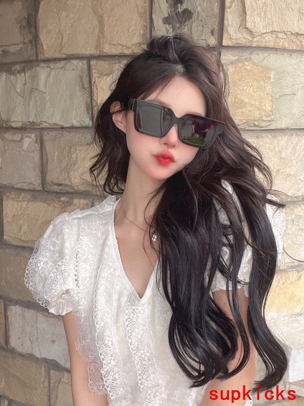 Close-up detail view of Louis Vuitton unisex sunglasses