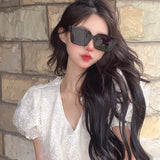 Close-up detail view of Louis Vuitton unisex sunglasses