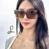 Lifestyle view of Louis Vuitton unisex sunglasses