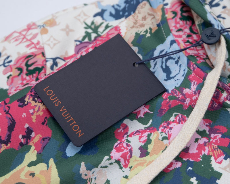 Flat lay presentation of Louis Vuitton luxury clothing with runway-inspired design