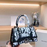 Ziva's Charm handbag – detail view (one versatile size)