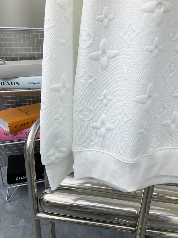 Back view of Louis Vuitton luxury clothing with label-forward styling