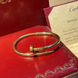 Side view of Cartier unisex jewelry piece