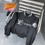 Side profile of Louis Vuitton luxury clothing with label-forward styling