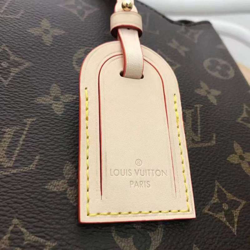 Handle and strap detail of signature structured women's handbag – women's designer-style accessory