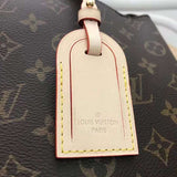 Handle and strap detail of signature structured women's handbag – women's designer-style accessory