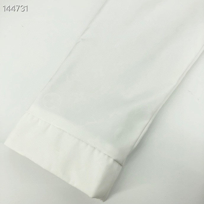 Close-up detail shot of Louis Vuitton luxury clothing with everyday silhouette