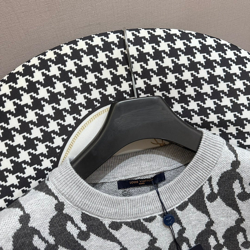 Flat lay presentation of Louis Vuitton luxury clothing with runway-inspired design