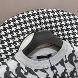 Flat lay presentation of Louis Vuitton luxury clothing with runway-inspired design