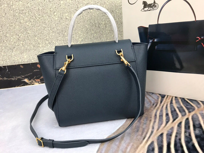 Handle and strap detail of polished signature women's handbag – women's luxury accessory