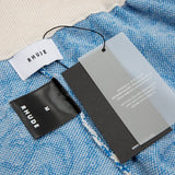 Close-up detail shot of Rhude luxury clothing with relaxed-fit cut