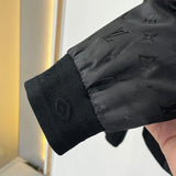 Back view of Louis Vuitton luxury clothing with label-forward styling