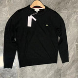 Side profile of Lacoste luxury clothing with monogram-inspired silhouette