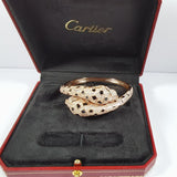 Close-up detail view of Cartier unisex jewelry piece