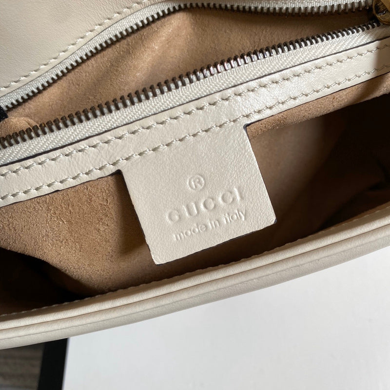 Side profile of signature polished women's handbag – women's designer-style accessory