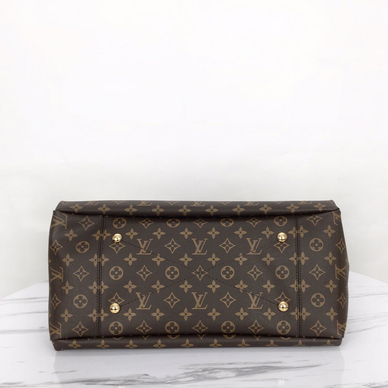 Styled lifestyle shot of modern statement women's handbag – women's luxury accessory