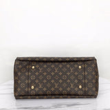 Styled lifestyle shot of modern statement women's handbag – women's luxury accessory