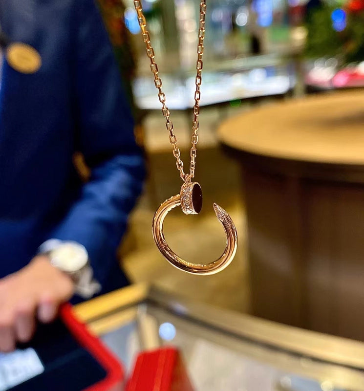 Side view of Cartier unisex jewelry piece
