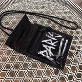 Styled lifestyle shot of signature statement women's handbag – women's designer-style accessory