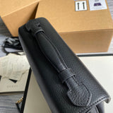 Handle and strap detail of everyday-luxe sleek women's handbag – women's statement bag