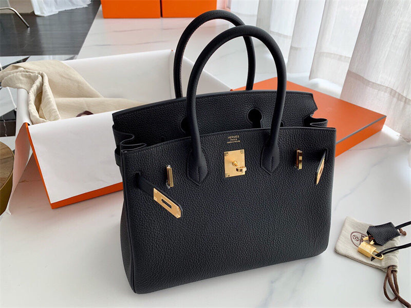 Side view of graceful structured handbag