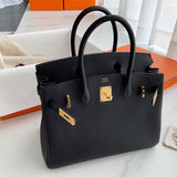 Side view of graceful structured handbag