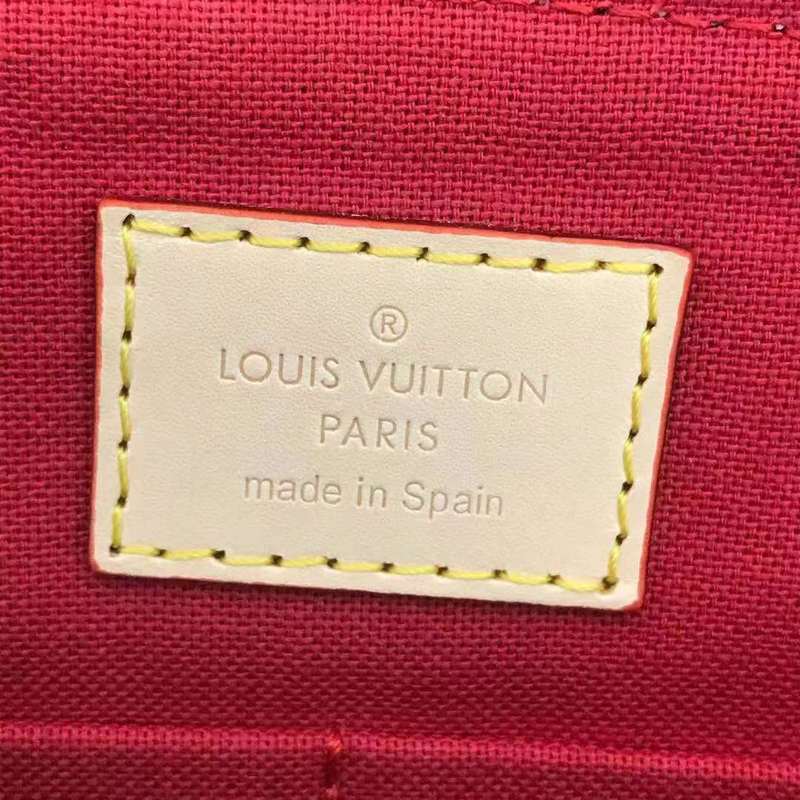 Side profile of signature structured women's handbag – women's designer-style accessory