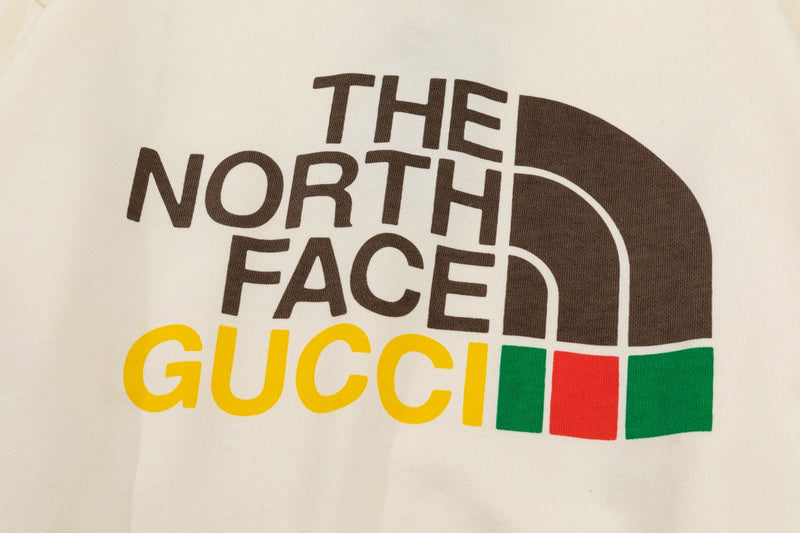 Flat lay presentation of Gucci luxury clothing with relaxed-fit cut