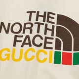 Flat lay presentation of Gucci luxury clothing with relaxed-fit cut
