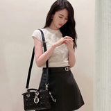 Close-up detail of elevated modern women's handbag – women's luxury accessory
