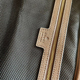 Side profile of refined classic women's handbag – women's statement bag