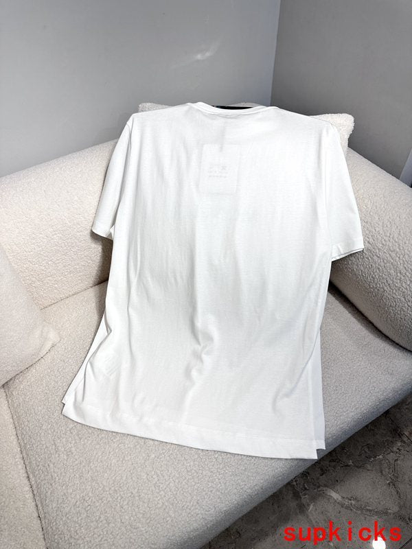 Flat lay presentation of Moncler luxury clothing with monogram-inspired silhouette