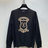 Front view of Louis Vuitton luxury clothing with label-forward styling