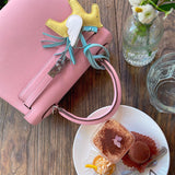 Side view of streamlined structured handbag