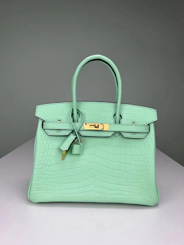 Side view of streamlined structured handbag