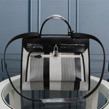 Side view of minimalist structured handbag