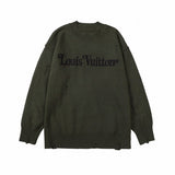 Close-up detail shot of Louis Vuitton luxury clothing with label-forward styling