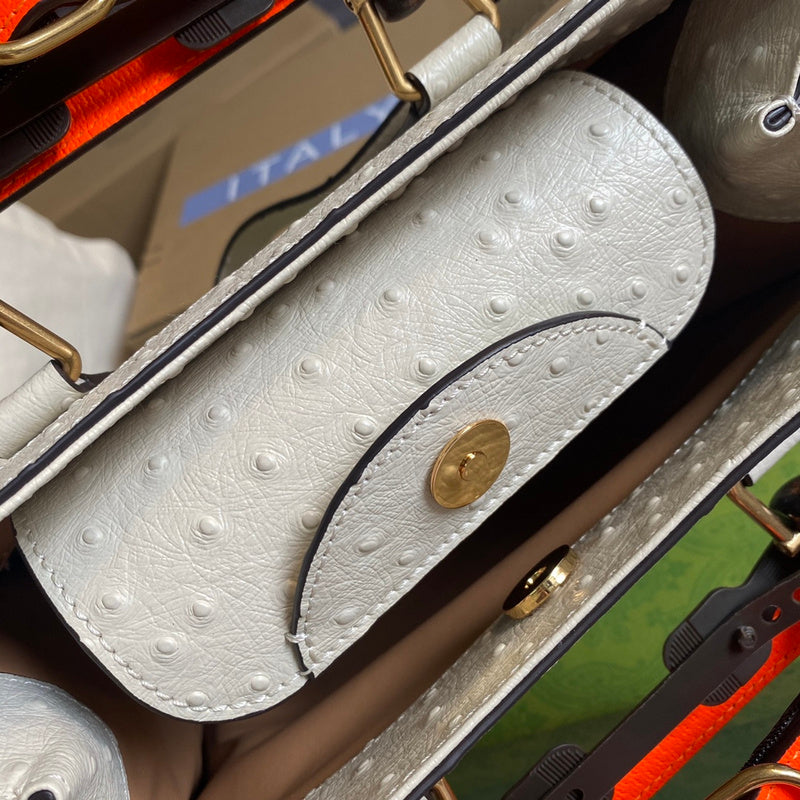 Close-up detail of signature structured women's handbag – women's luxury accessory