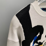Side profile of Louis Vuitton luxury clothing with logo-detail design