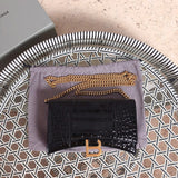 Side profile of sleek polished women's handbag – women's luxury handbag