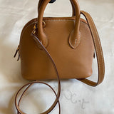 Side view of minimalist structured handbag