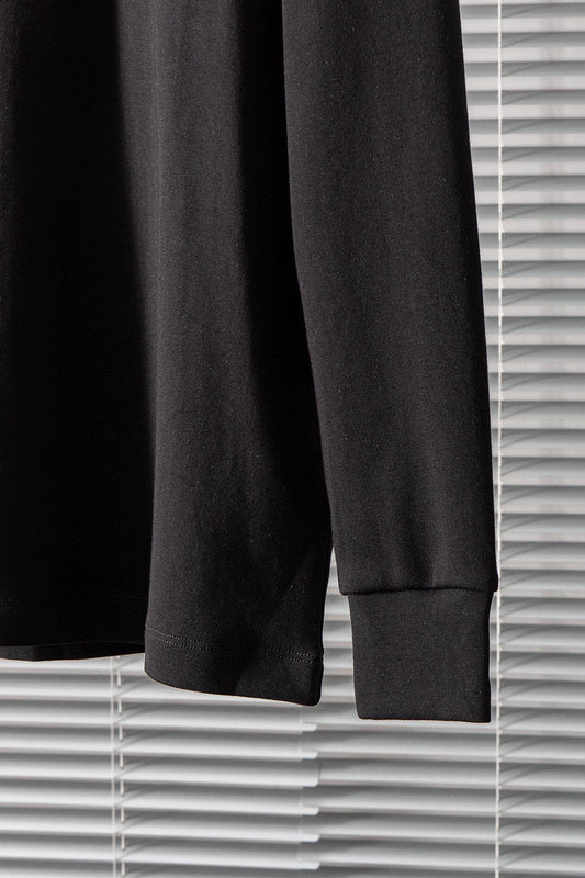 Side profile of Louis Vuitton luxury clothing with label-forward styling