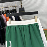 Front view of Rhude luxury clothing with label-forward styling