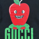Flat lay presentation of Gucci luxury clothing with signature branding