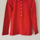 Flat lay presentation of Lacoste luxury clothing with logo-detail design
